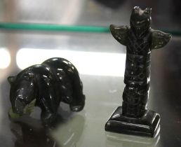 Two Canadian/Inuit Jade carvings, a Totem Pole 5.5cm high and a bear with fish in its mouth 3.5cm lo