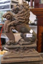 A cast iron doorstop in the form of a lion
