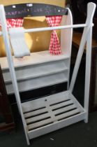 A white painted child's wooden clothes rail with shoe rack