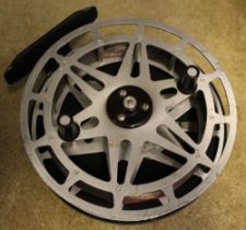 An unmarked 5" metal spool centre pin reel with black back plate