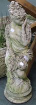 A cast garden statue of a lady