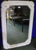 An Art Deco design bevelled edge wall mirror in white painted frame