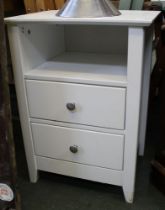 A modern white two drawer bedside table