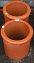Two small terracotta chimney style planters