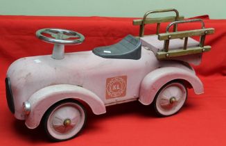 A child's tin ride on/push along fire engine