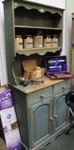 A modern pine paint-washed kitchen dresser