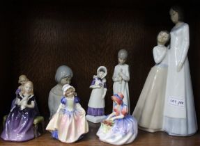 Eight various porcelain figures to include Royal Doulton examples and others