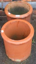 Two small terracotta chimney style planters