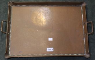 An early 20th century hammered copper tray stamped Olbury on the reverse