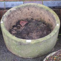 A substantial circular cast garden planter