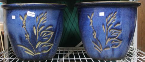A pair of large blue glazed ceramic garden pots