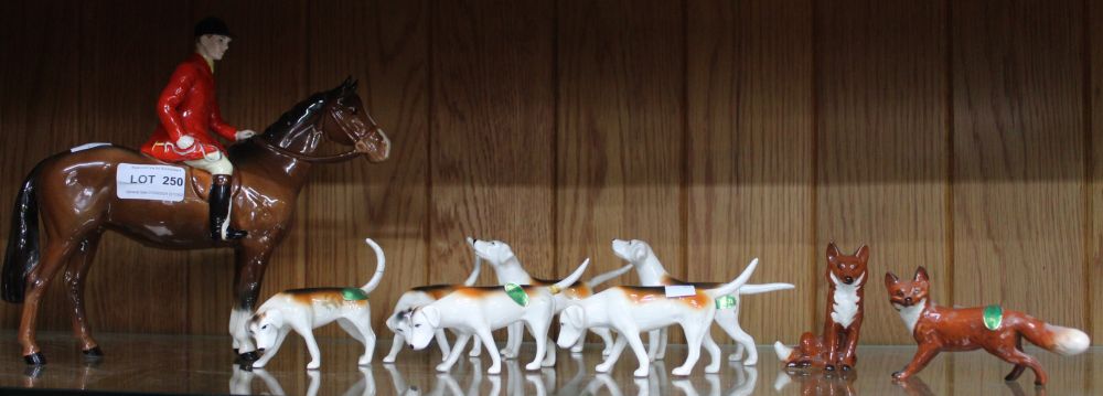 Beswick - Hunting Group, huntsman on brown horse, six hounds and two foxes