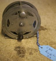 A vintage "Circle" 2" metal fly fishing reel with ratchet, stamped made in Japan