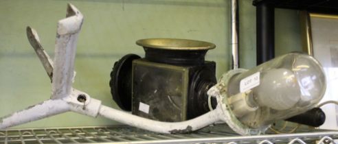 An industrial style corner cast lamp with a converted carriage lamp