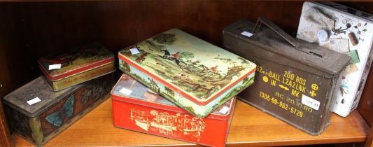 A military ammunition case with a selection of vintage pictorial tins