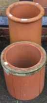 Two terracotta chimney style planters