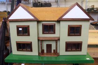 A substantial scratch built dolls house with a selection of furniture