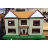 A substantial scratch built dolls house with a selection of furniture