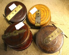 Four vintage wooden fly reels