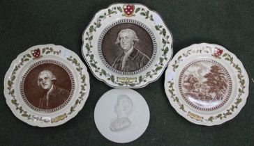 Three commemorative Wedgwood plates and a commemorative plaque