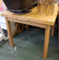 A modern beech draw leaf table