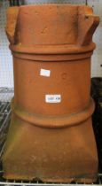 A terracotta garden planter in the form of a chimney