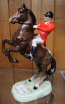 Beswick - A rearing huntsman on brown horse no. 868