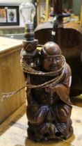 A carved wooden Buddha figure as a lamp base
