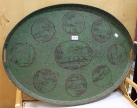 A large oval green painted tin tray decorated with country scenes possibly 19th century