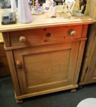 A Pine cupboard single drawer over locking cupboard door