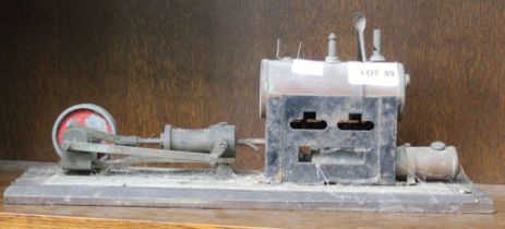 A vintage model stationary steam engine on wooden plinth