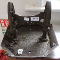 A cast iron boot scraper
