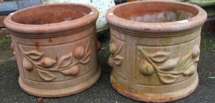 A pair of substantial hand made terracotta circular pots
