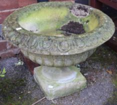 A cast garden circular planter on stand
