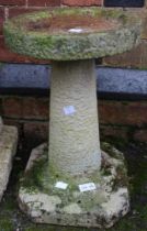 A cast garden birdbath