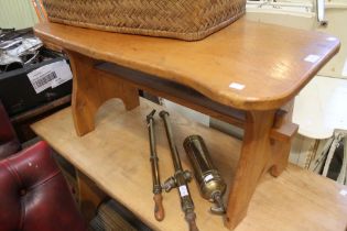 A light oak tavern style low occasional table