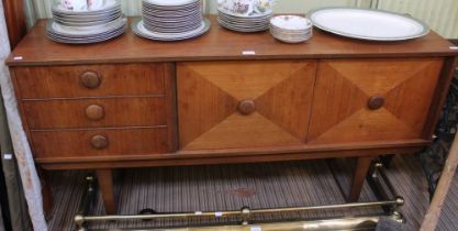 A mid century teak sideboard