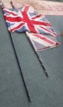 Two vintage Union Jack flags mounted on poles