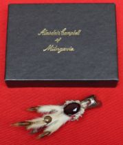A Scottish claw brooch, stone set, in a "Alasdair Campbell of Milngavie" box