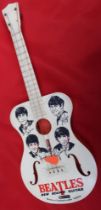 A "Beatles-New Sound Guitar" a plastic Selco product, made under licence in England