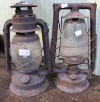 Two old paraffin tilley storm lanterns