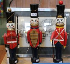 Three painted wood soldiers, 45cm high