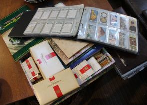 A collection of cigarette and tea cards, mostly loose, some albums