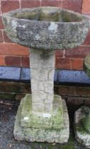 A cast garden birdbath