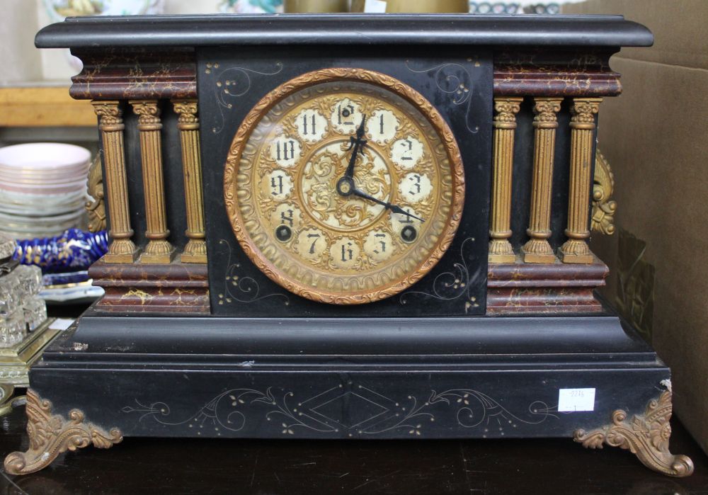 A late Victorian ebonised cased mantle clock of architectural design, with eight-day chiming movemen
