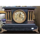 A late Victorian ebonised cased mantle clock of architectural design, with eight-day chiming movemen