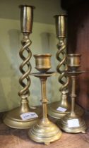 Two pairs of brass candlesticks