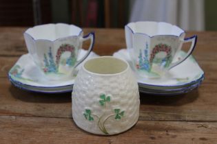 A Belleek honey pot, together with two Shelley Cups, and five Shelley saucers