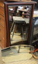 A mid century clip frame wall mirror, with a wooden framed rectangular wall mirror