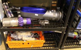 Dyson - Four handheld cordless vacuums and a space heater with a crate of accessories